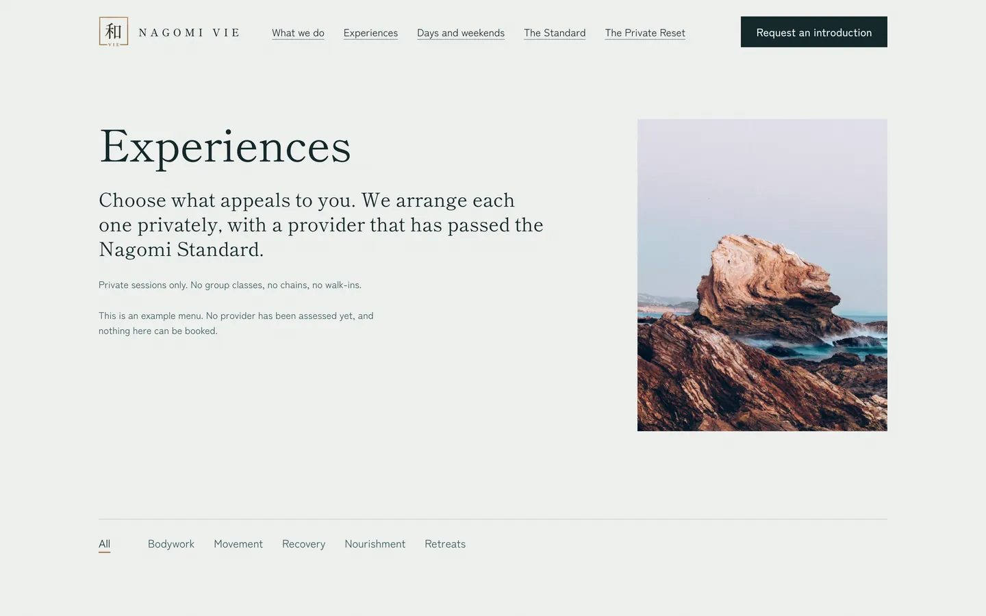 The Nagomi Vie experiences page: a heading, an introduction and a photograph of a rock in the sea.